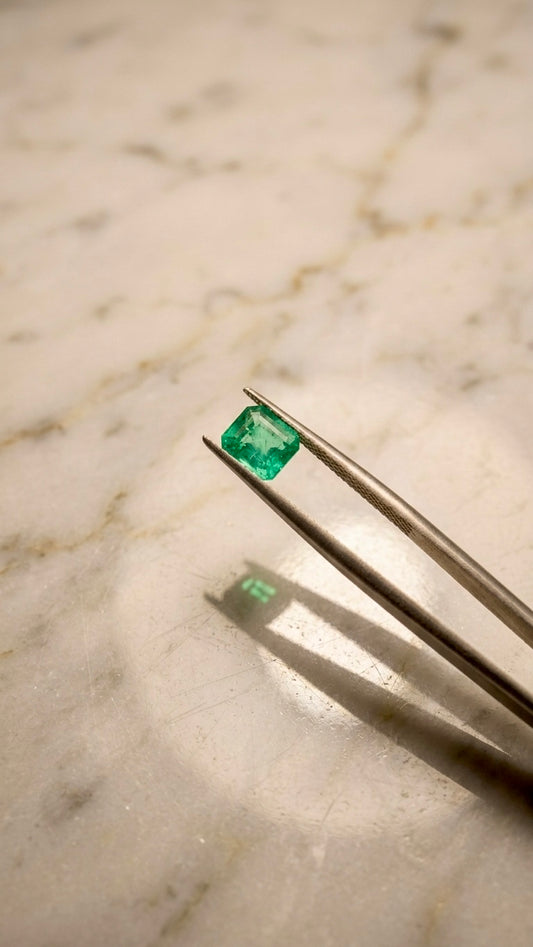 14K yellow gold ring set with a 0.776 ct emerald and diamonds
